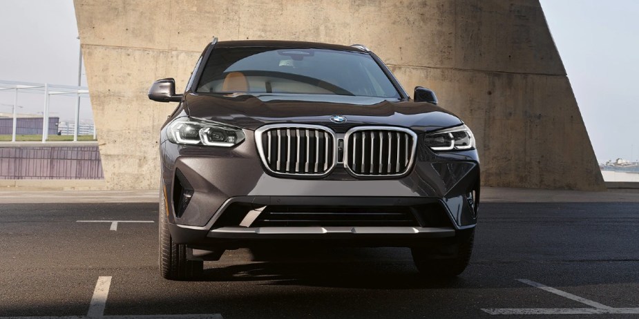 A black 2023 BMW X3 small SUV is parked. 