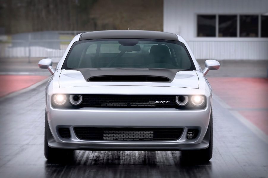 A 2023 Dodge Challenger SRT Demon 170 flashes its LED lights on the drag strip.