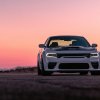 A white 2023 Dodge Charger RT Scat Pack Widebody shows off its muscular stance.