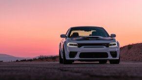 A white 2023 Dodge Charger RT Scat Pack Widebody shows off its muscular stance.