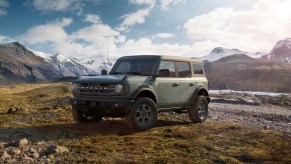 Grey 2023 Ford Bronco in front of mountain background.