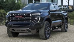 The 2023 GMC Canyon parked in front of a house