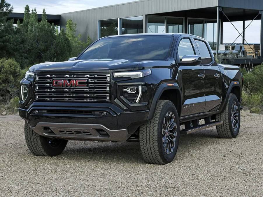 The 2023 GMC Canyon parked in front of a house