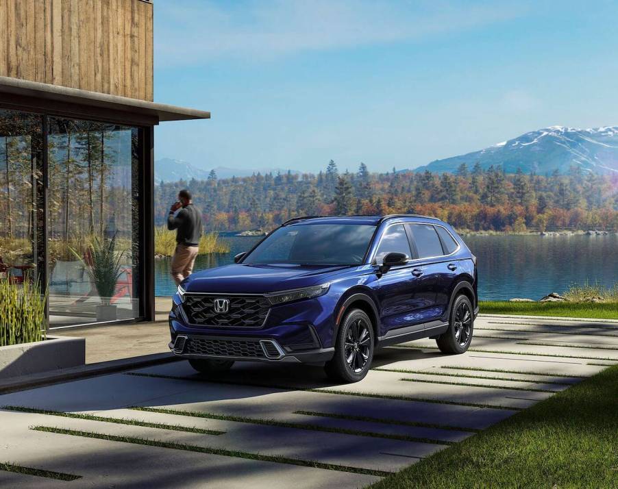 The 2023 Honda CR-V parked by a home