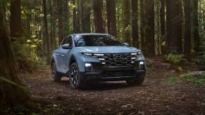 The 2023 Hyundai Santa Cruz off-roading in the woods