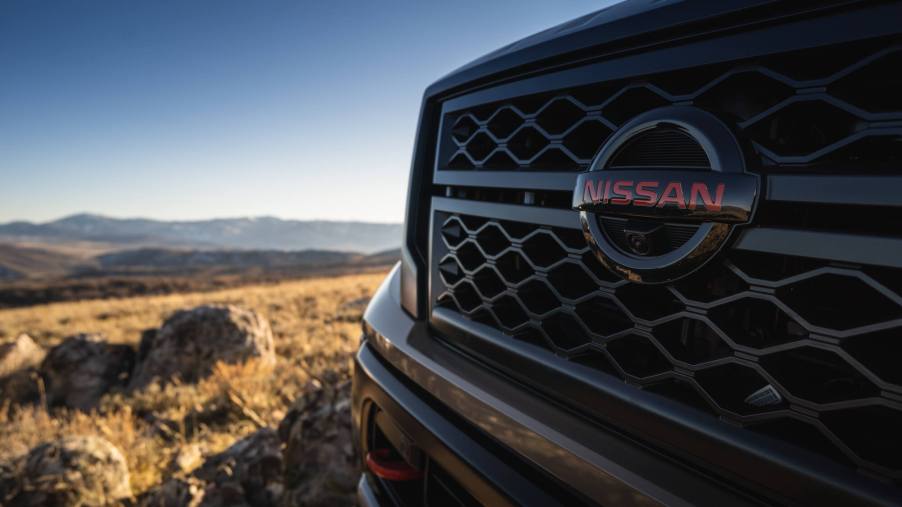 The Nissan Titan XD is placed in front of rocky scenery, potentially at a crossroads like the figurative one Nissan is facing with the truck.