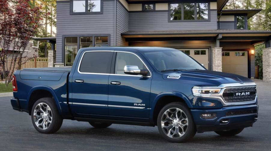 The 2023 Ram 1500 parked infront of a home