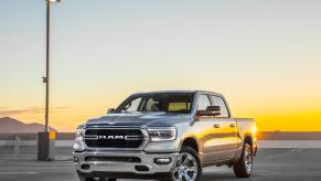 The 2023 Ram 1500 parked on pavement at dusk