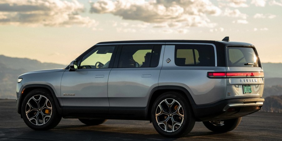 A gray 2023 Rivian R1S full-size SUV is parked.