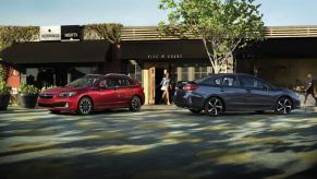 The 2023 Subaru Impreza lineup, featuring a red Impreza hatchback and a gray Impreza sedan