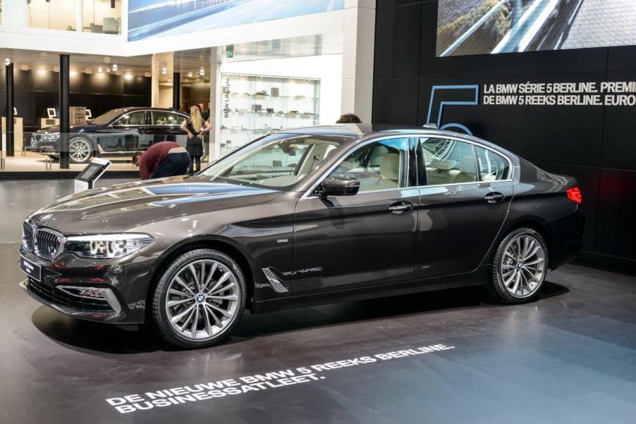 A black BMW 5 Series executive car model on display at the 95th European Motor Show in Brussels, Belgium