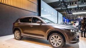 A gray Mazda CX-5 on display at an auto show. The CX-5 is one of the best small SUVs in 2023