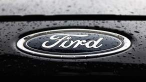 A blue Ford logo on a black vehicle.