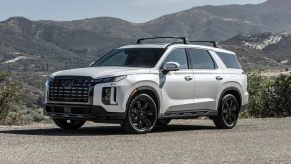 Front angle view of white 2023 Hyundai Palisade midsize SUV