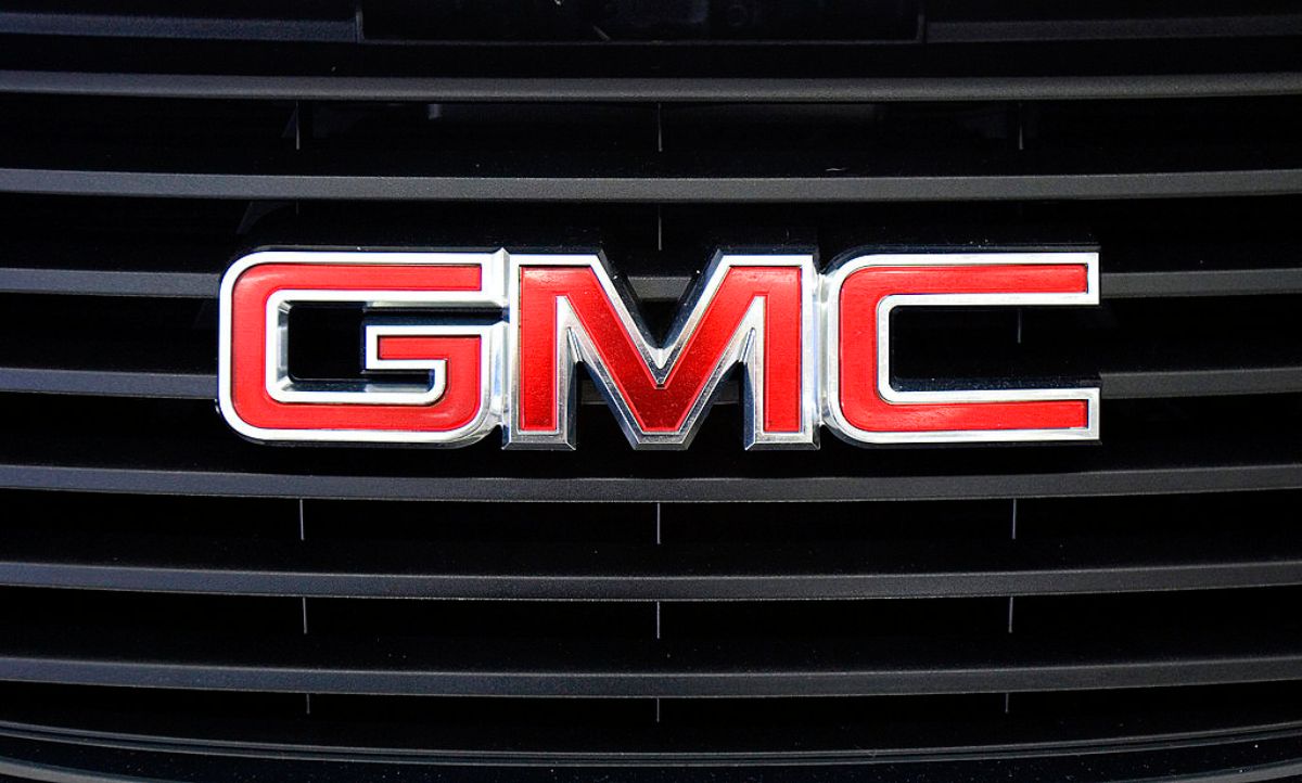 A GMC logo seen on the front of an SUV.