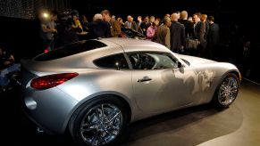 A silver Pontiac Solstice coupe at a car show