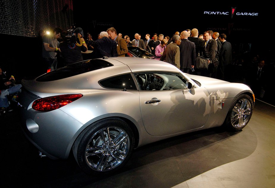 A silver Pontiac Solstice coupe at a car show