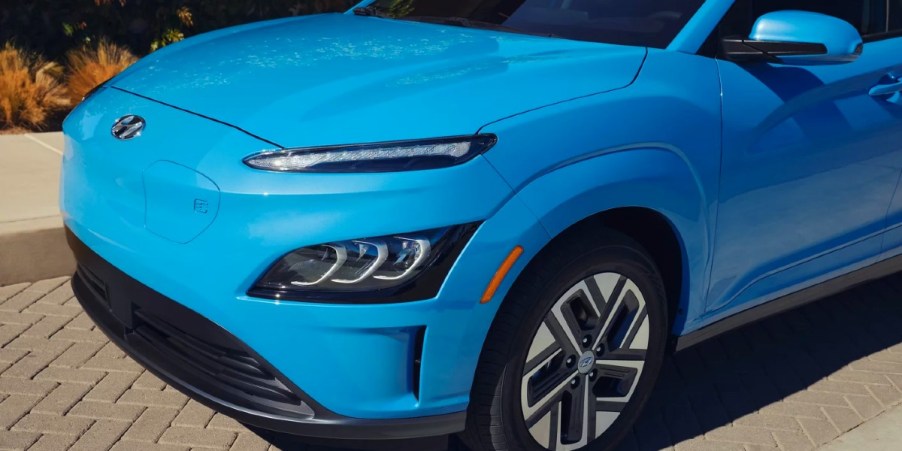 The front of a blue 2023 Hyundai Kona Electric subcompact electric SUV.