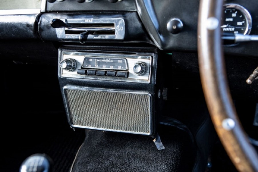 A radio in a 1961 Aston Martin is a solid example of relaxing ASMR sources in classic cars.