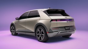 A Hyundai Ioniq 5 Disney 100 Platinum edition on a light purple background.