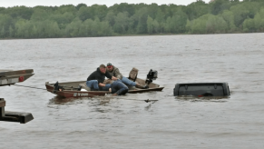 The roof of a Jeep Wrangler sticking up from the water of a Texas lake.