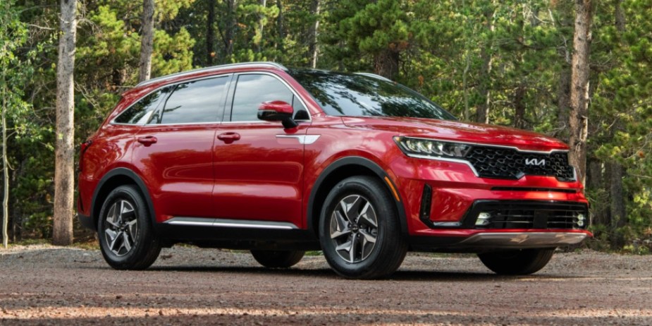 A red 2023 Kia Sorento Hybrid midsize hybrid SUV. 