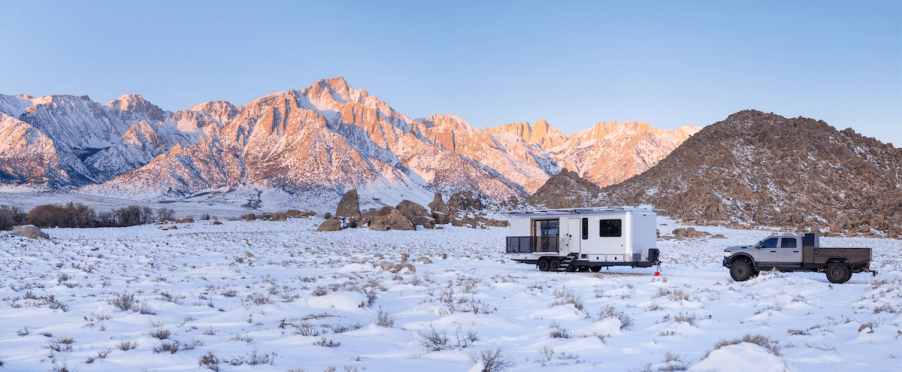 The Living Vehicle HD-Pro in a snow field. This is the most expensive camper trailer on the market.