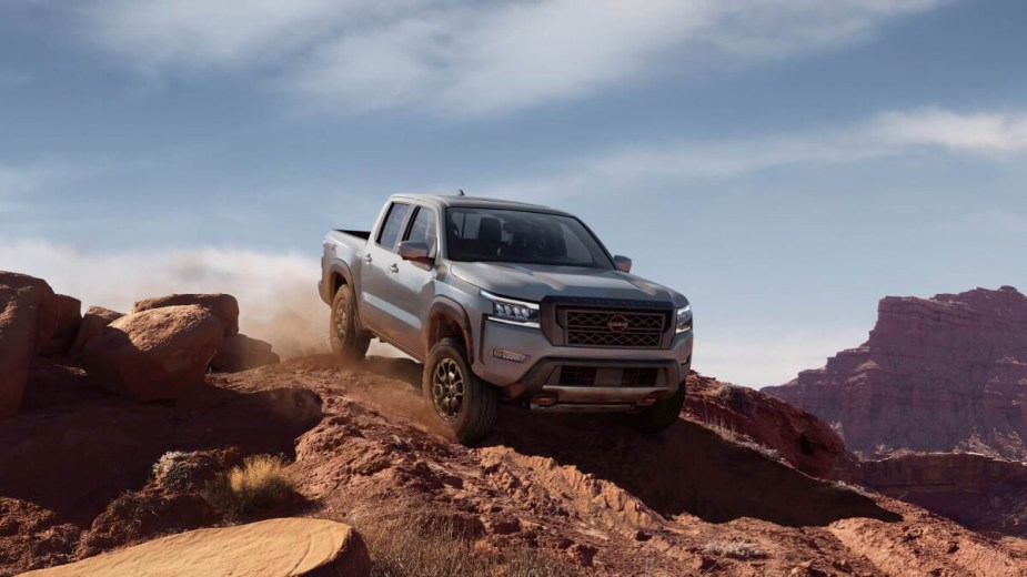 Nissan's old-school truck, the Frontier, is driving off-road.