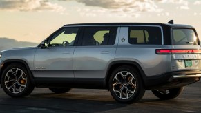 A gray 2023 Rivian R1S full-size electric SUV is parked.