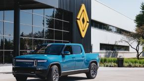 The blue Rivian electric truck parked in front of the company's factory in Normal, Illinois.