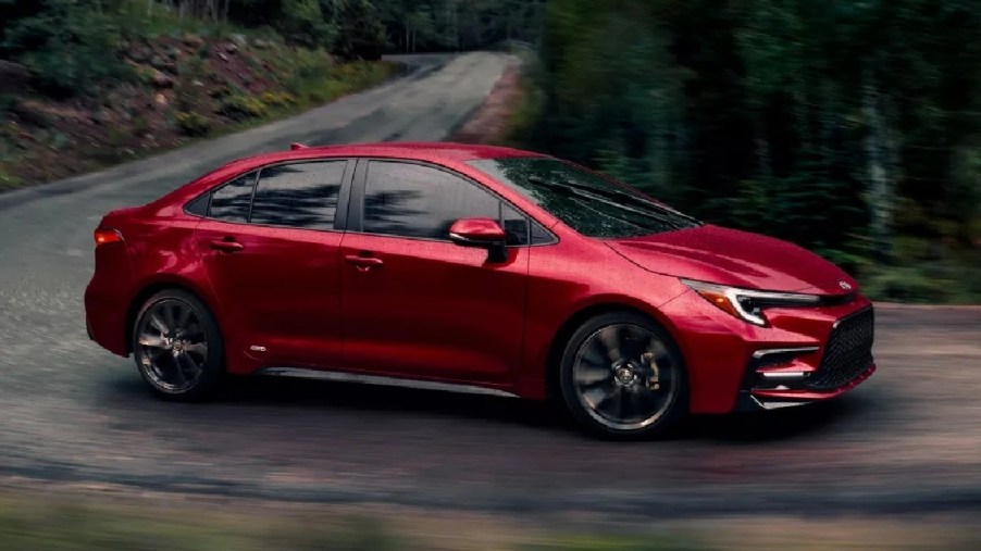 Side view of red 2023 Toyota Corolla compact sedan