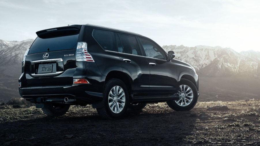 Rear view of a black Lexus GX 460 with mountains in the background.