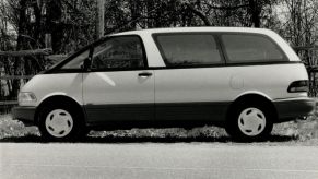 A black and white photo of a Toyota Previa.