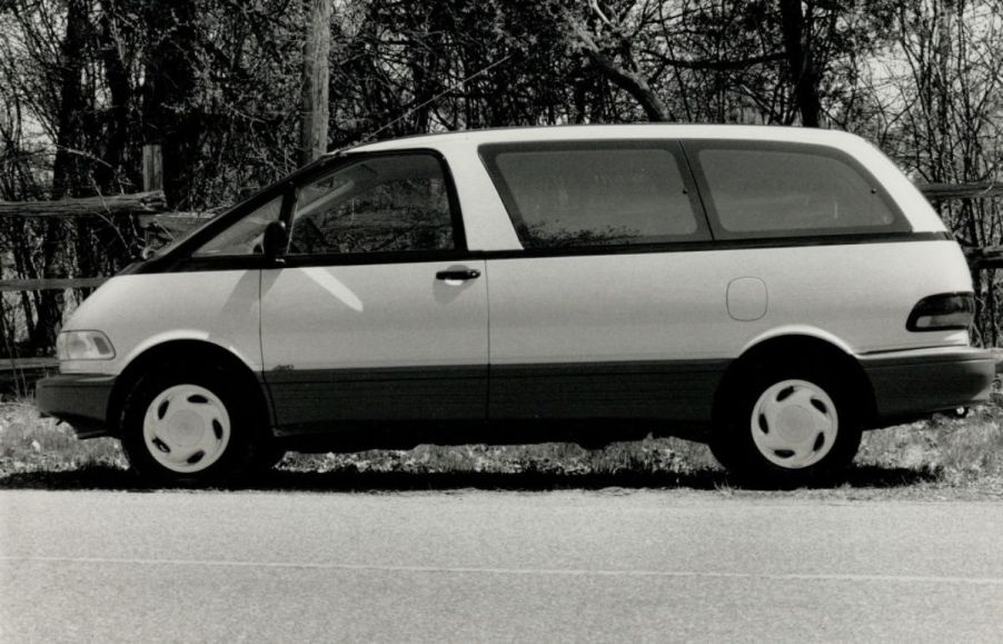 A black and white photo of a Toyota Previa.