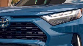 The front of a blue 2023 Toyota RAV4 Hybrid small hybrid SUV.