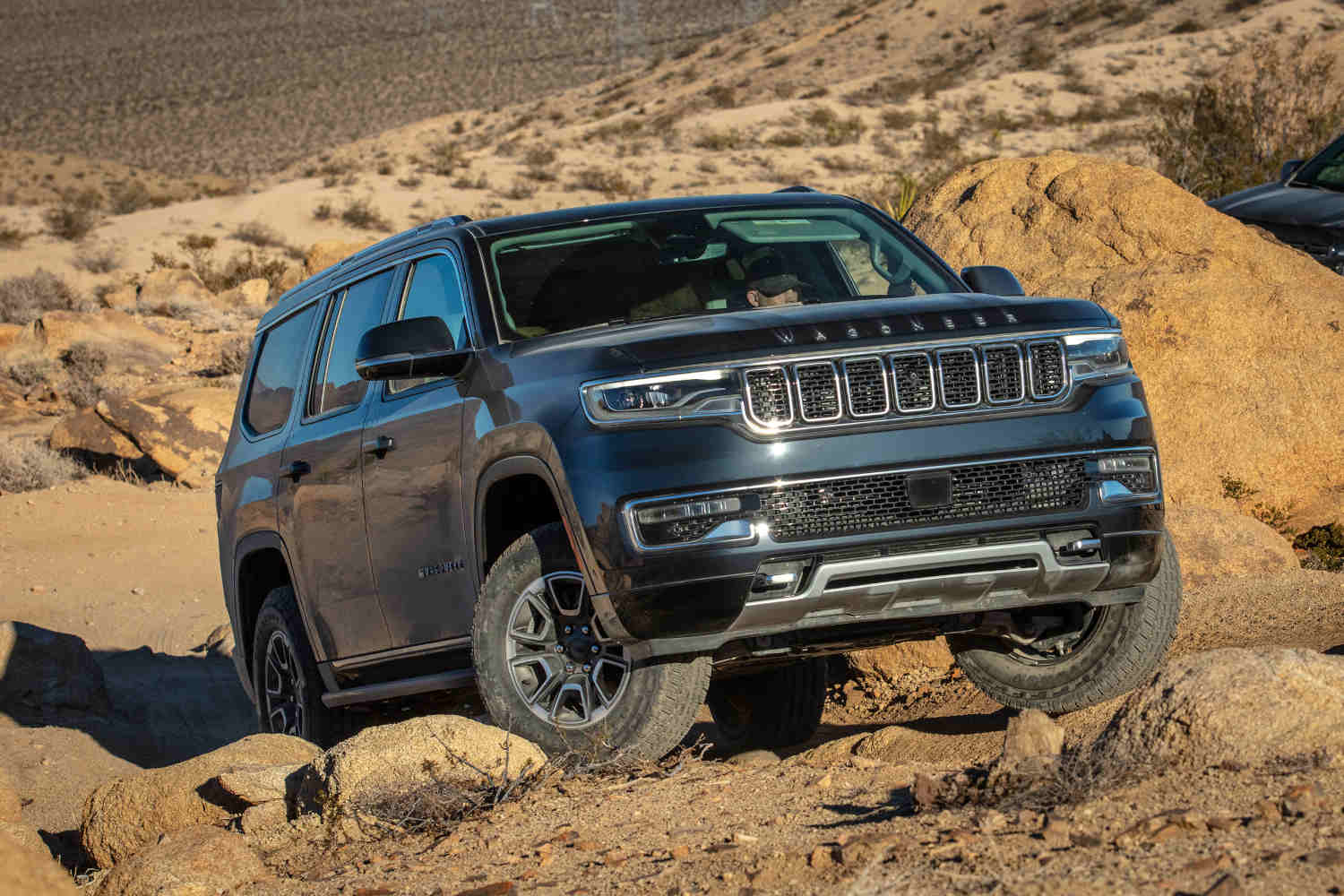 The best 4x4 SUVs includes this Jeep Wagoneer in the dirt