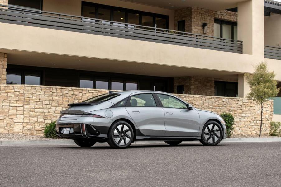 A rear and side profile shot of a gray 2023 Hyundai Ioniq 6 electric midsize fastback sedan model