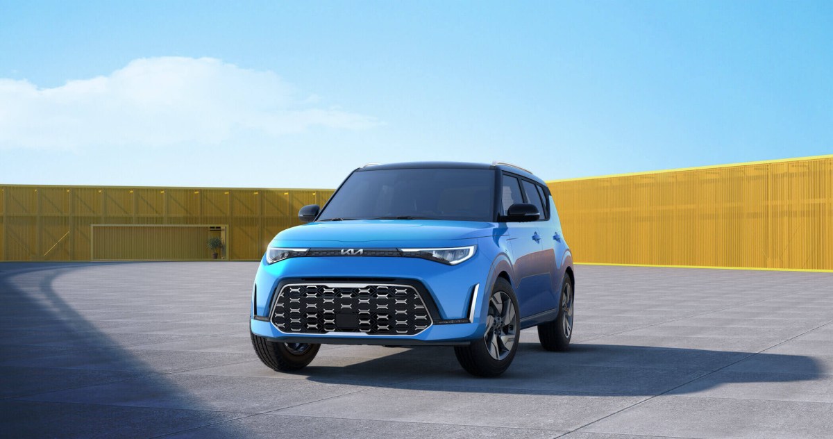 A blue 2023 Kia Soul parked outside with blue skies.