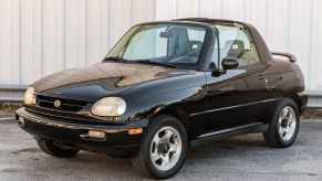 A black 1996 Suzuki X-90 4x4 SUV