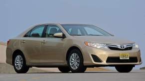 A 2012 Toyota Camry sedan parked on a road