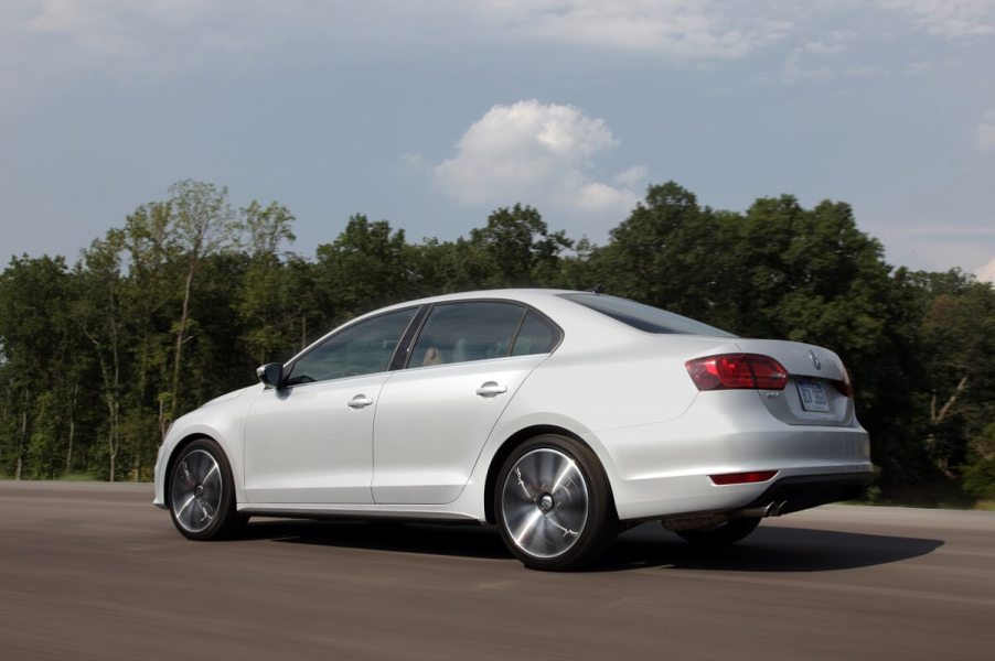 A used 2012 Volkswagen Jetta shows off its white paintwork and rear-end styling.