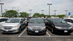 A Honda dealership with multiple 2013 Honda Odyssey outside