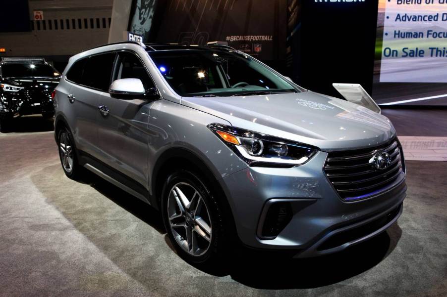 A silver 2017 Hyundai Santa Fe, one of the worst used Hyundai SUVs, on display at an auto show.