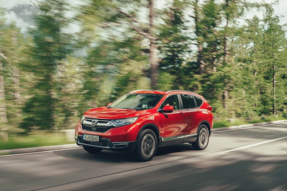 A red 2018 Honda CR-V is driving.