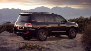 The 2021 Toyota Land Cruiser, the last model sold in the U.S., with mountains in the background.