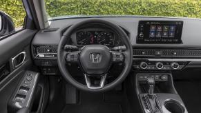 The interior and steering wheel in a 2022 Honda Civic