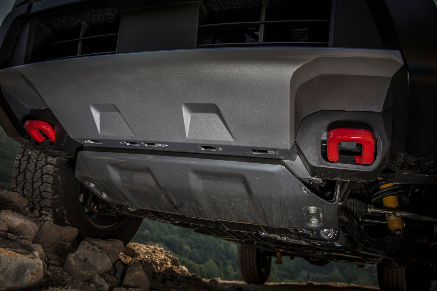 The skidplate of a Nissan Frontier off-road pickup truck.