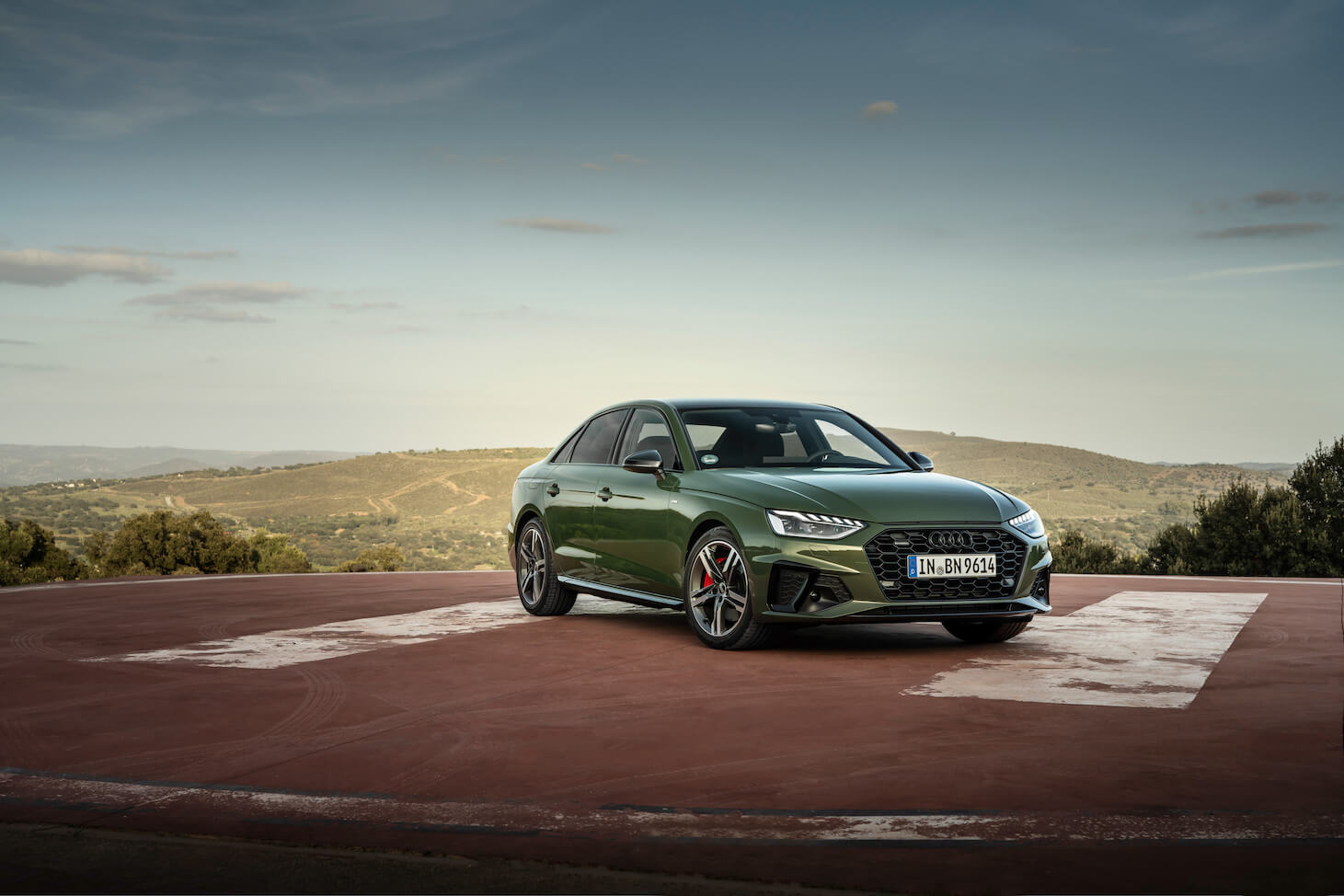 A green 2023 Audi A4 sedan parked at sunrise, which is one of the best Audi vehicles for safety.