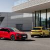 A red 2023 Audi S3 parked in front of another yellow Audi model in front of a building