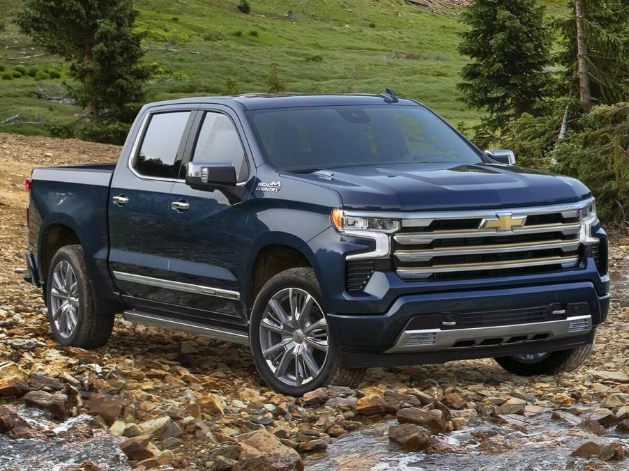 The 2023 Chevy Silverado Duramax off-roading in a rocky river bed